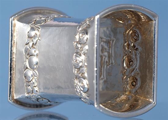 A 1930s Arts & Crafts planished silver waisted napkin ring, by Omar Ramsden. Height 58mm weight 2oz/64grms